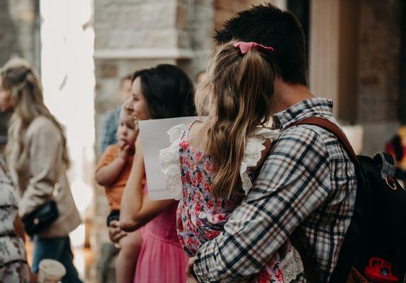 Families connecting in the lobby after services