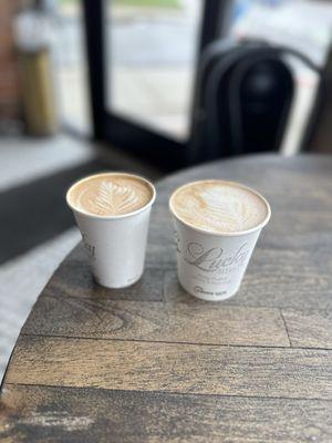 Pb&j latte and flat white. Well done latte and well done decor for old school vibes.