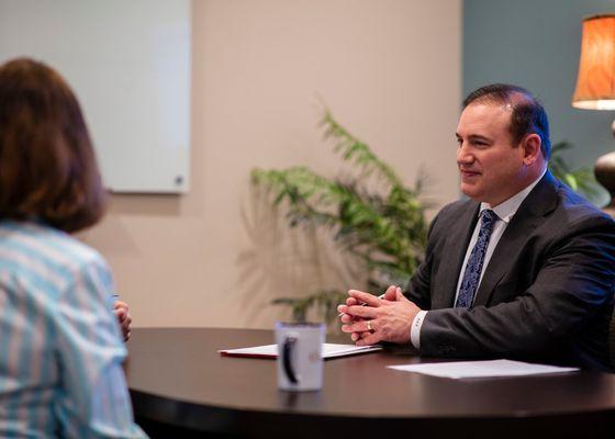 Michael Neuenschwander, CPA, CFP®  meeting with clients.