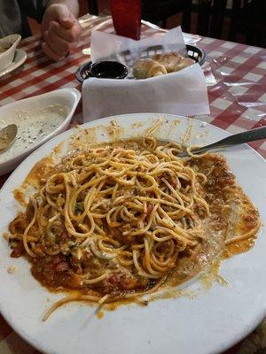 Spaghetti with meat sauce & Alfredo on the side mixed in.