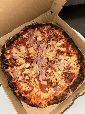 The pineapple pizza with pepperoni