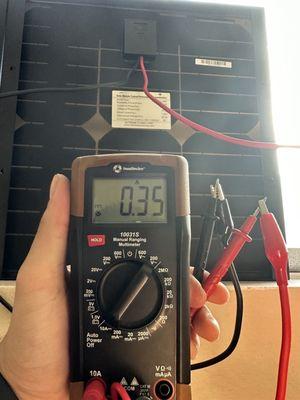 A "mythical non-existent" multimeter reading amperage off a DC solar panel.