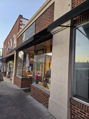 The outside window and sign of the Dogwood Restaurant.