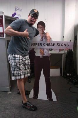 A Super Cheap Signs designer with "Jerry" the life size cut out