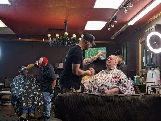 My dad getting a haircut and his first facial shave in years