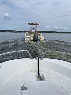 Being towed back by staff after the engine left us stranded in the bay