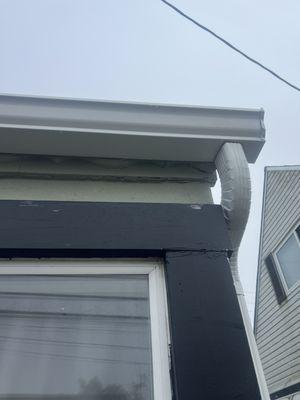 Partial pic of new gutter w downspout.