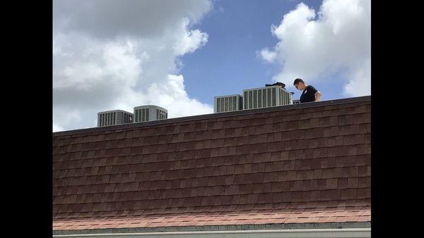 Robert working on my mom's ac for its annual tune up.