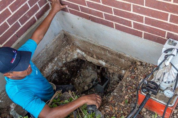 Pressing piers to repair a slab foundation.