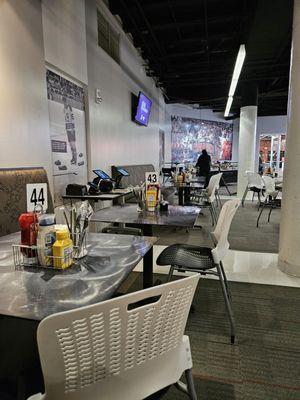 Tables and chairs waiting for patrons.