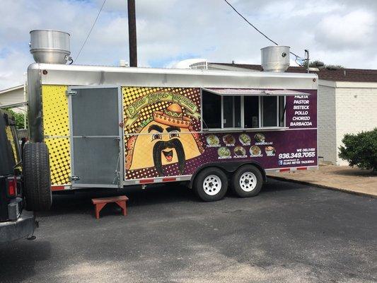 Small family owned food truck in the parking lot of a Motel 6, no sitting area, not even trash cans