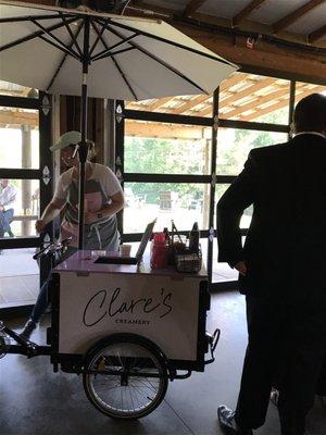 The Ice Cream cart next to the wedding cake