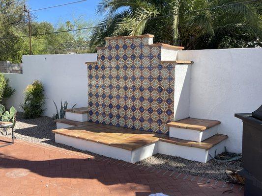 Outdoor Talavera statement wall for a fireplace.