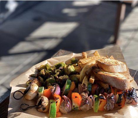 Steak and veggies skewers plate.