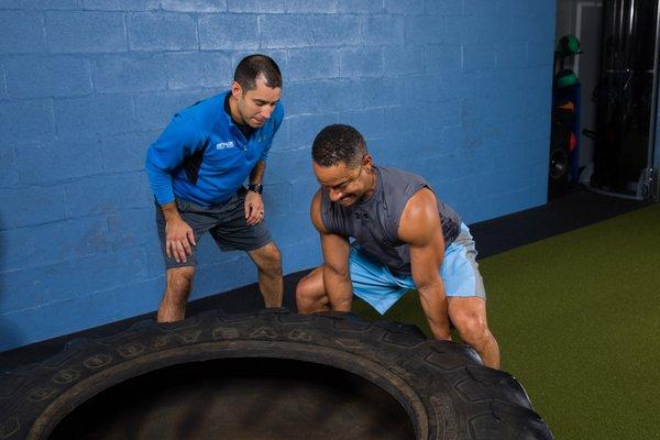 Flipping a 350lb tire is one way to strengthen your back, legs, shoul... you get the picture. 
 It's heavy. Move it. Get stronger. Repeat