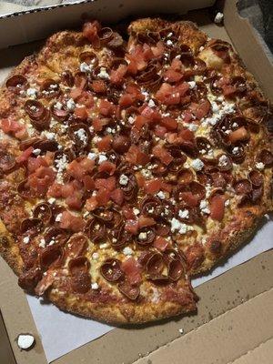 Double pepperoni, feta, and tomatoes. Try it!