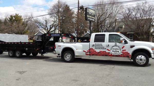 Business truck with goose neck trailer.