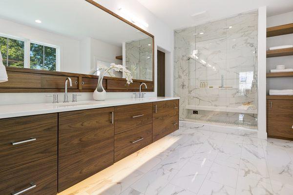 Traditional meets modern bathroom renovation in Potomac, classic fixtures blend with sleek lines, timeless tile paired with contemporary