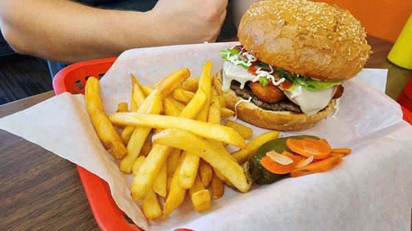 Burger with chicken nuggets and fries