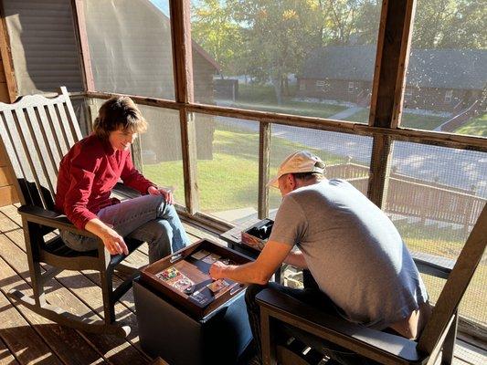 Screened porch with rocking chairs