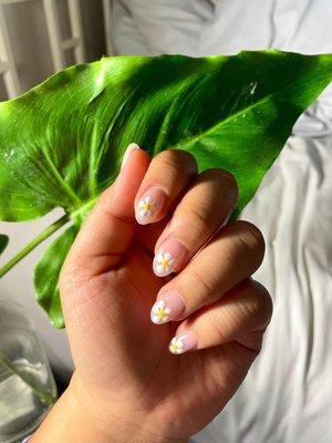 I asked for a daisy nail design on nude short almond acrylics!