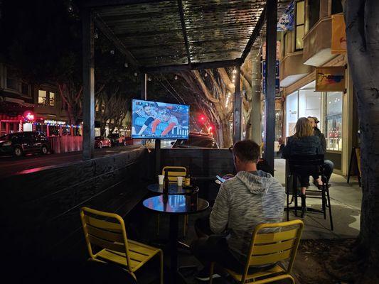 Patio with a TV outside to watch the game and drink a beer.