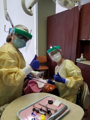 Doctor and Staff giving thumbs up while working on my Nephew's front tooth.