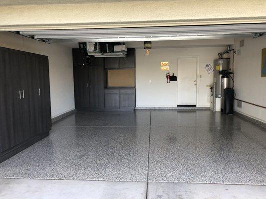 Complete garage renovation with a fresh epoxy floor and custom built cabinets! Ask us about storage options!