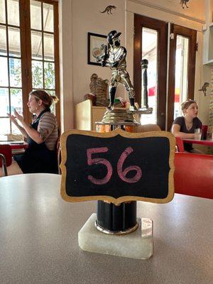 The table numbers, recycled trophies.