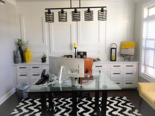 Shadow boxes + sliding barn door added to give this office space some more character