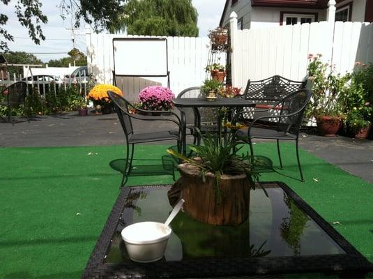 Outdoor seating only. Flowers in pots -- or cut tree limb! -- on every table.