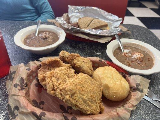 Fried chicken, red beans & rice and a chicken sandwich in back.