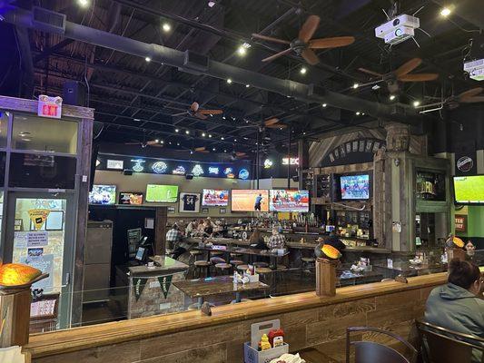 View of bar area with lots of tvs.  Cool atmosphere.