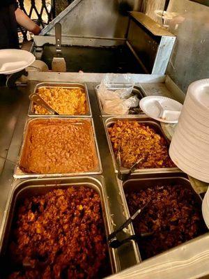 Catering beef pork and chicken with a side of rice and beans