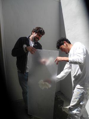 Yefim & helper clean our skylight protector.