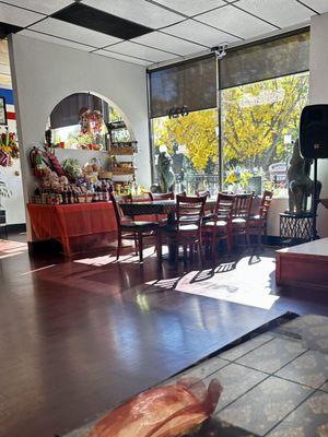 Dining area and Asian food goods for sale.