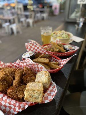 The full line up- 5 piece, 2 biscuits, tater wedges, fried pickles, salad