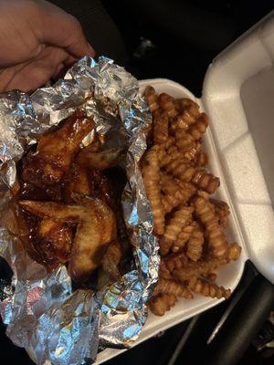 This is fresh hot lemon pepper barbecue wings and fresh fries. Please excuse the picture it's bad lighting.