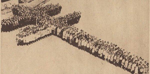 In 1919 several hundred Philadelphia school children form a living TB double cross. Posted with review 04/23/23