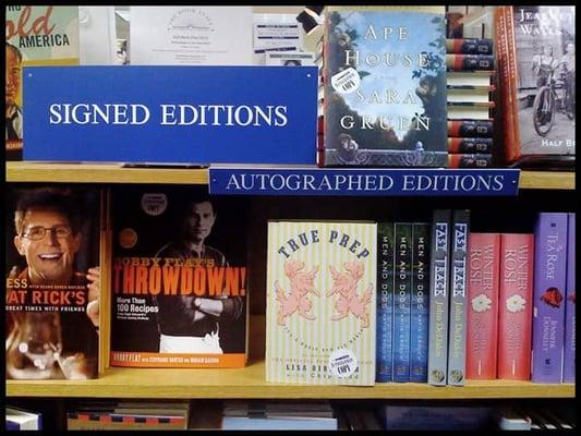 A photo of the store's packed shelf of autographed titles