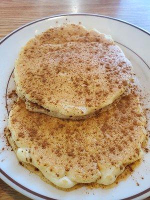 Pancakes with cinnamon sprinkled on top.