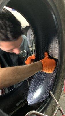 Getting a permanent patch from inside the tire. Fred's Tires.