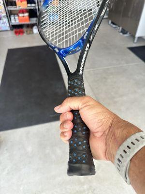 Freshly regripped tennis racquet, done on the spot!