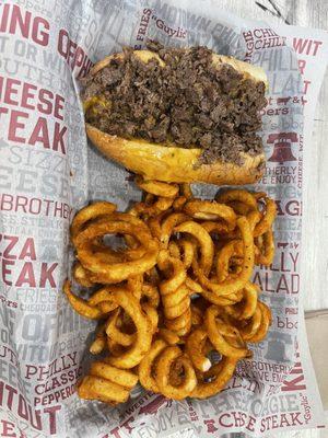 Half Classic Philly Cheesesteak with Cheddar Sauce and Curly Fries