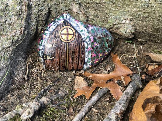 One of the many painted stones throughout the cemetery