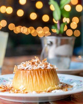 Flan - traditional coconut custard, caramel and coconut flakes