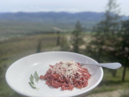 Our beet pasta is delicious prepared here with butter, parmesan, and sage