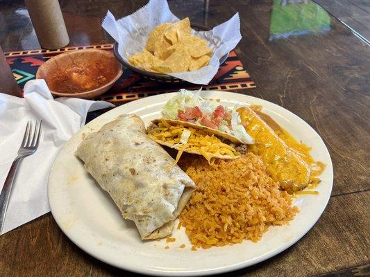 #40 on the menu. pork Burrito, beef taco, cheese enchilada with rice and beans.