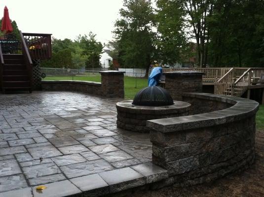 Paver Patio, retaining wall, fire pit, and pillars done by  Two Brothers Landscaping