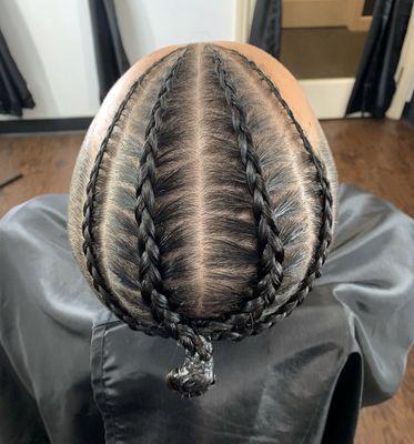 A 4 set of Cornrow braids with a clean skin fade